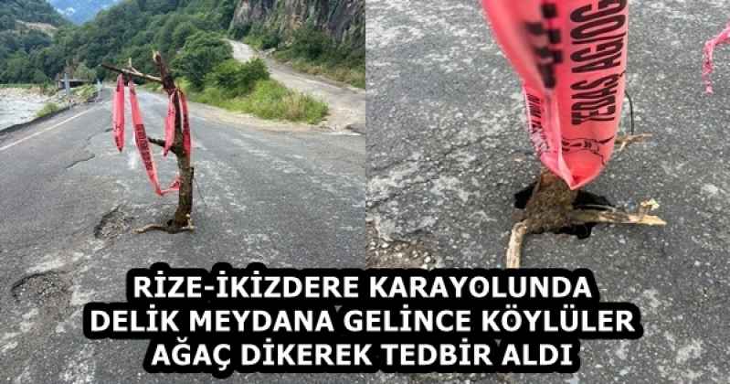 RİZE-İKİZDERE KARAYOLUNDA DELİK MEYDANA GELİNCE KÖYLÜLER AĞAÇ DİKEREK TEDBİR ALDI